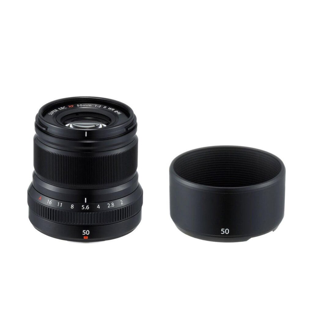 XF_50_f2_black_4 Fujifilm Fujinon XF 50mm f/2 R WR lens, black is shown together with a matching hood, both with "50" in white text against a white background. The black lens shows the manual focus and aperture rings.