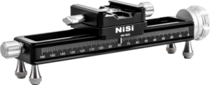Black NiSi NM-180S Macro focusing stage - Macro stage with slide mount, adjustment knobs, measurement markings and four tripod-style feet on a white background.