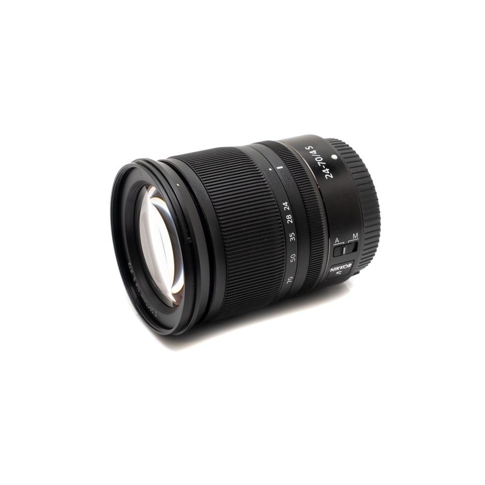 Nikon Z6 II (Kunto K5, Takuuta 22kk, Shuttercount 1100) - Käytetty kamerarunko, esitetty mustana yksityiskohtaisine säätimineen ja ominaisuuksineen, eristettynä valkoiselle taustalle.