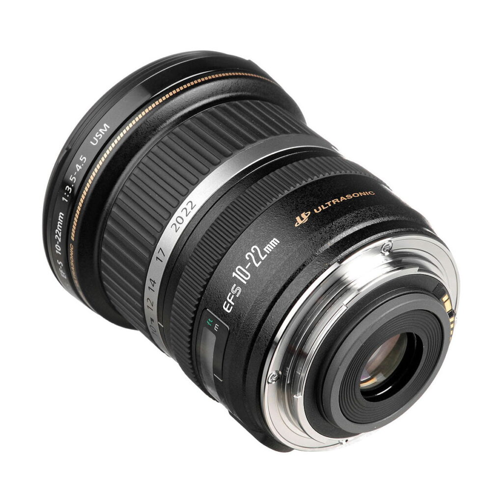 Canon_EF-S_10-22mm_f_3_5-4_5_USM_003 A Canon EF-S 10-22mm f/3.5-4.5 USM lens, black body and hopeful mounting ring, focal length markings and Ultrasonic logo visible, set diagonally on a white background.