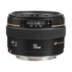 The Canon EF 50mm f/1.4 USM lens with focus distance markings, AF/MF switch and large focus ring is shown on a white background.