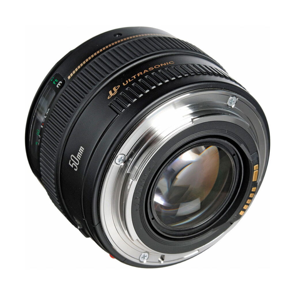 Canon_EF_50mm_f_1_4_USM_003 A close-up of the Canon EF 50mm f/1.4 USM lens highlights its metal lens mount, focus ring and the gold Ultrasonic logo on the black barrel.