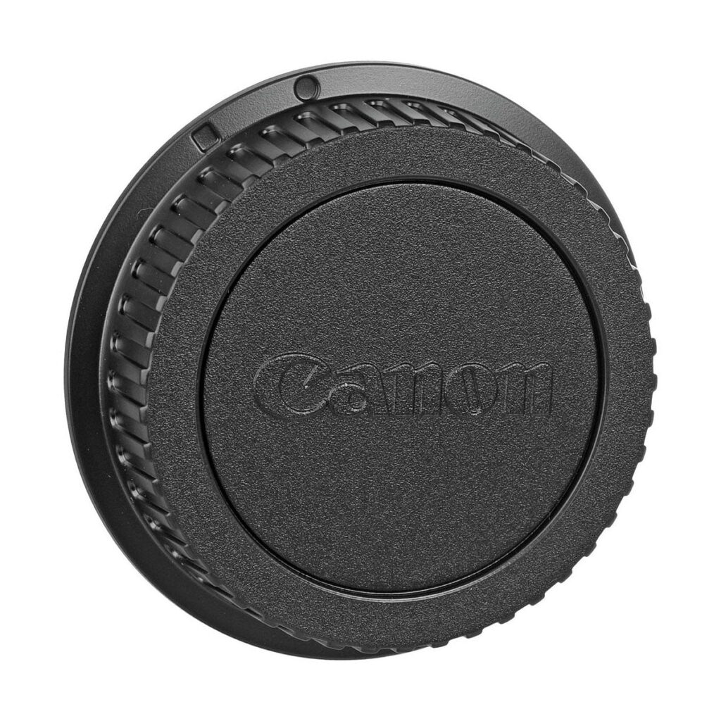 Canon_EF_50mm_f_1_4_USM_005 Close-up of the Canon EF 50mm f/1.4 USM lens hood with ridges and Canon logo in the centre, against a white background.