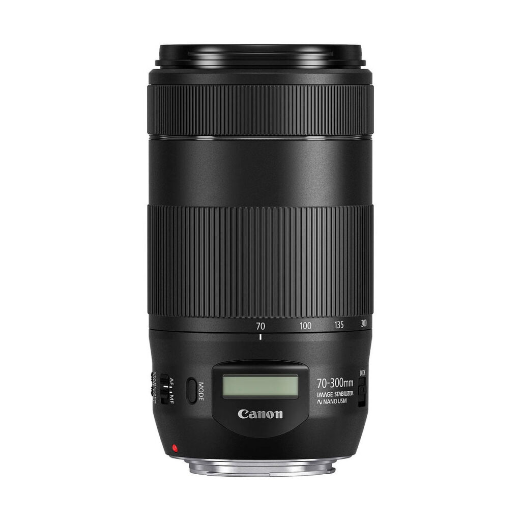Canon_EF_70-300mm_f_4-5_6_IS_II_USM_002 The Canon EF 70-300mm f/4-5.6 IS II USM is a black camera lens with image stabilizer and digital display, shown against a white background.
