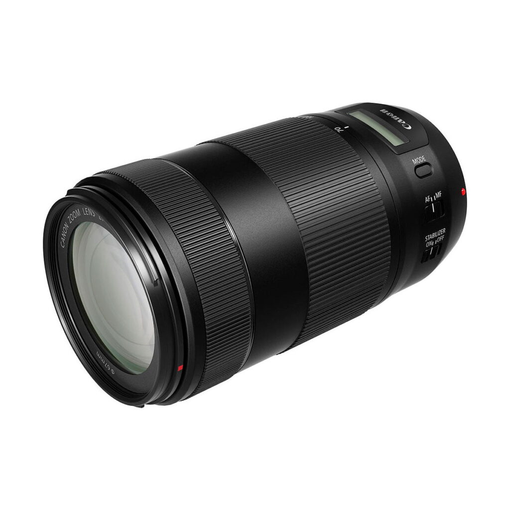 Canon_EF_70-300mm_f_4-5_6_IS_II_USM_003 The black Canon EF 70-300mm f/4-5.6 IS II USM telephoto lens with textured grip, digital display and multiple control dials is shot at an angle against a white background.