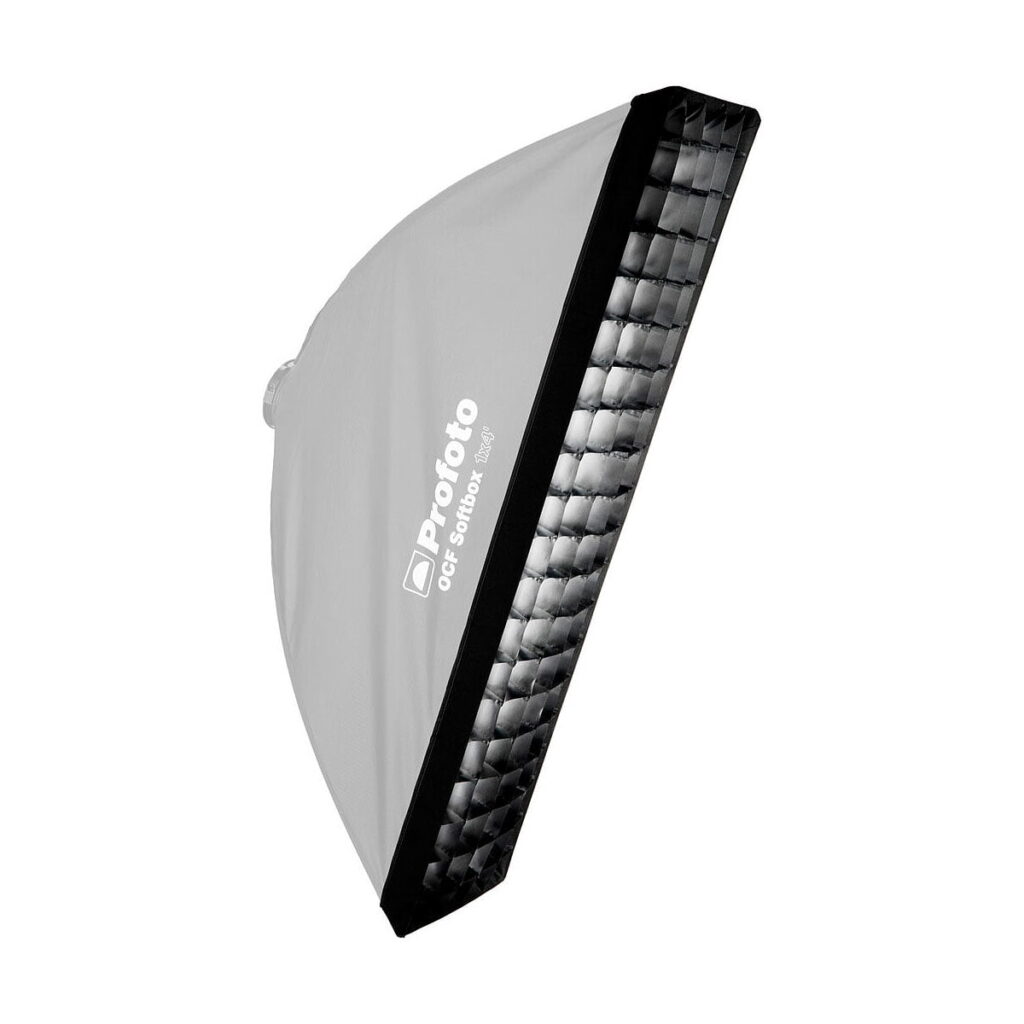 Profoto_OFC_Softgrid_1_x_4_Stripille_002 Profoto OFC Softgrid 1 x 4 Strip with grating attached is shown diagonally. The softbox is white and black with the Profoto logo and model name on the side, and the grating covers the front.
