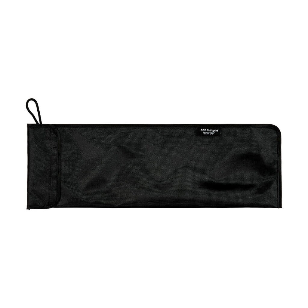 Profoto_OFC_Softgrid_1_x_4_Stripille_003 Profoto OFC Softgrid for 1 x 4 Strip, rectangular and black, with zipper and small fabric loop on the left, lying flat on a white background. Its subtly textured fabric has a small label near the top edge.