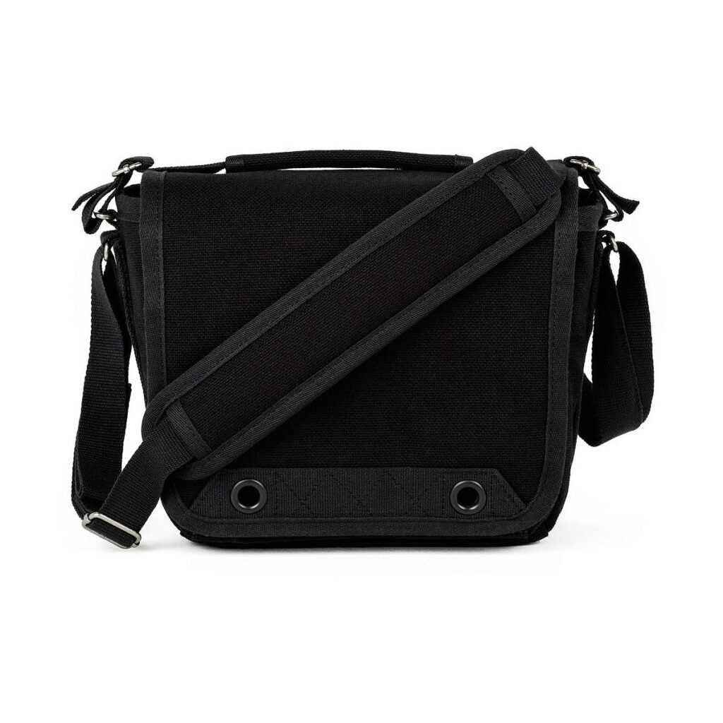Think_Tank_Retrospective_4_V2_0-Musta_002 Think Tank Retrospective 4 V2.0 - Black is a black messenger bag with top handle, adjustable shoulder strap, front flap with two metal grommets at the bottom, and textured fabric trim.