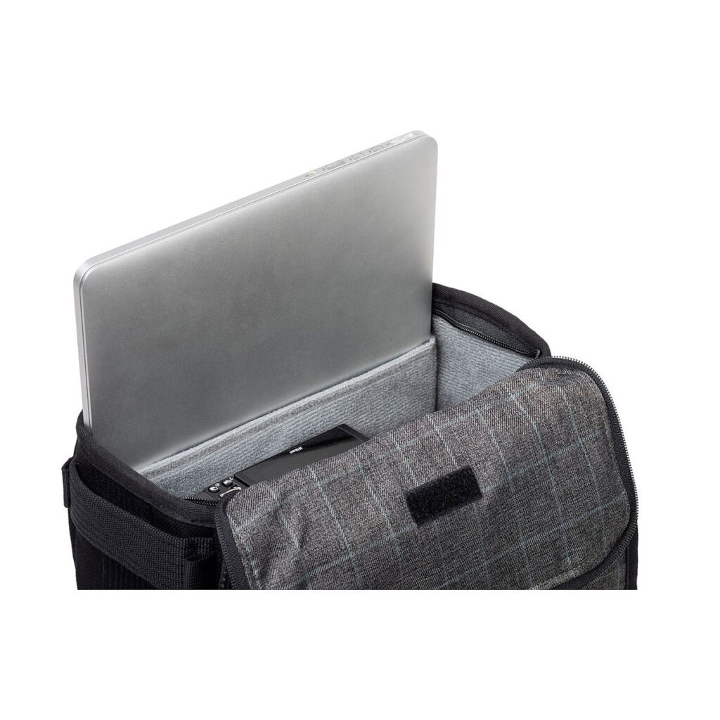 Think_Tank_Retrospective_Backpack_15-Black_003 Think Tank Retrospective Backpack 15, black, contains a grey laptop in a grey checked padded sleeve with black velcro fastening and a small black device.