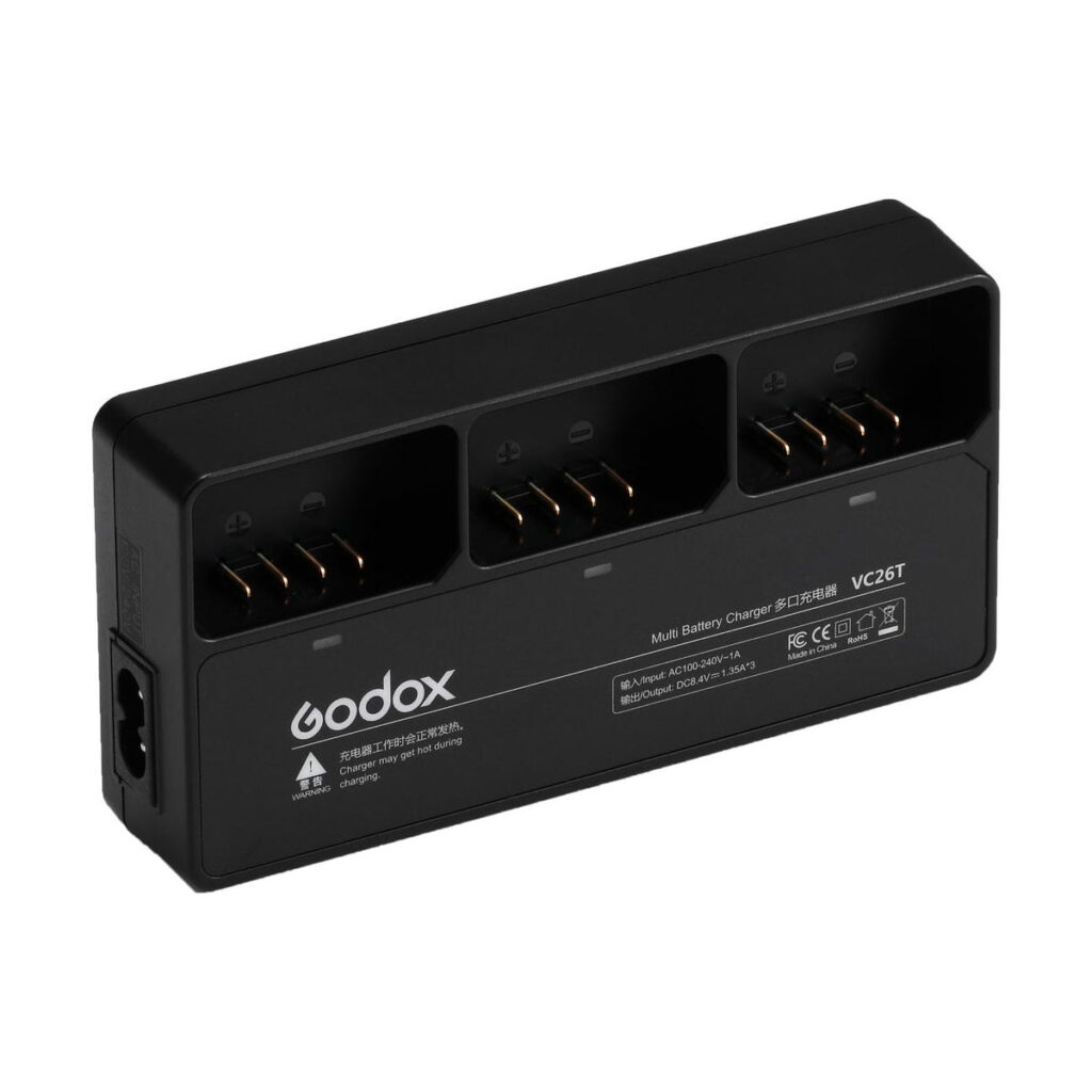 godox_vc26t Black Godox VC26T triple charger AD100 / Godox V1 charger with three charging slots, labelled indicators and a left-hand socket designed for camera batteries.