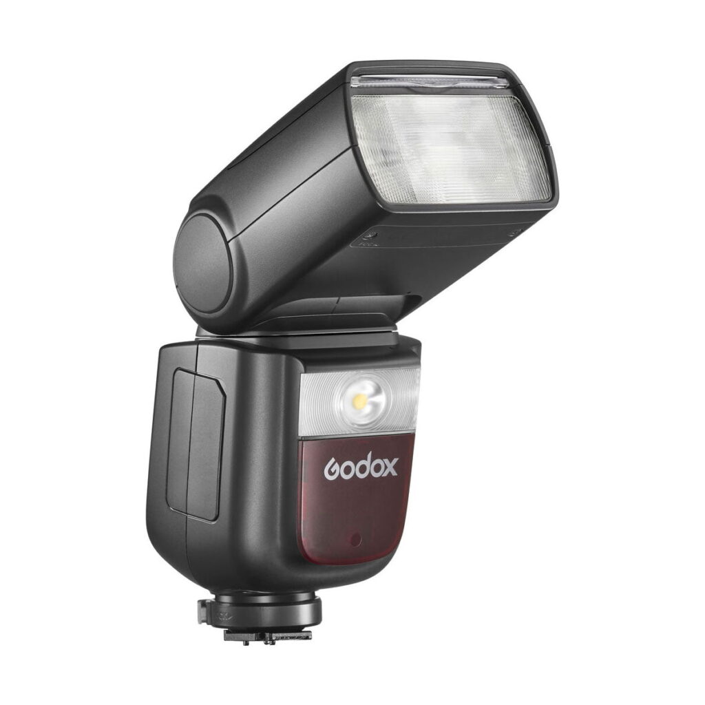Godox-Ving-V860-III-TTL---Sony-3 Black Godox Ving V860 III TTL flash for Sony cameras with rectangular head, adjustable tilt and small yellow indicator light against a white background.