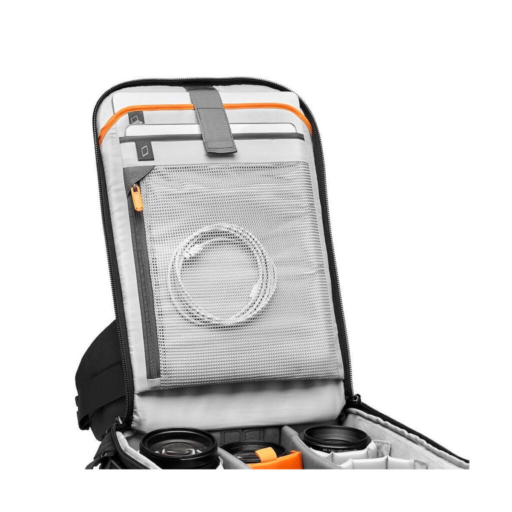 Lowepro_Flipside_400_AW_III-Musta_004 The Lowepro Flipside 400 AW III Camera Backpack (black) is pictured with the lid open to reveal organized compartments for lenses and accessories, a mesh zippered pocket with cable, and padded dividers for camera gear.