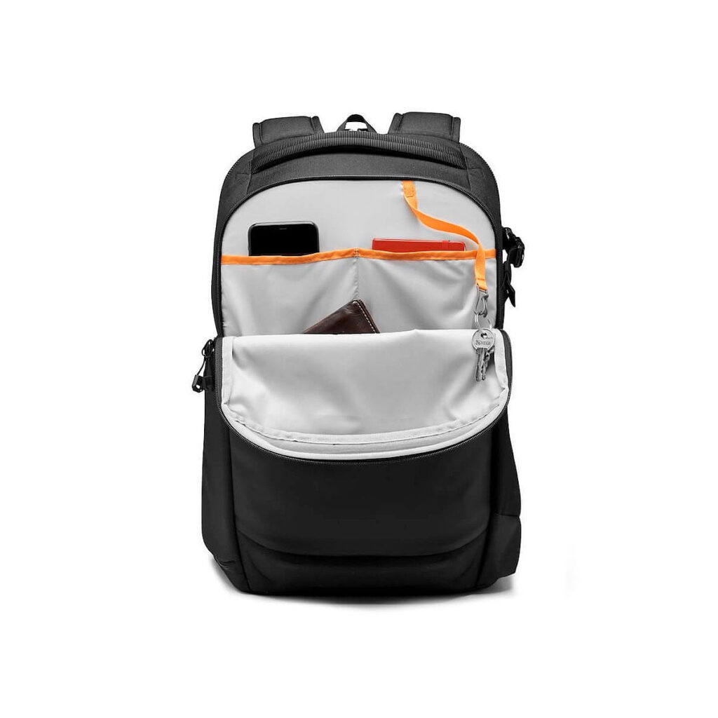 Lowepro_Flipside_400_AW_III-Musta_006 The Lowepro Flipside 400 AW III Camera Backpack, black with zipped front pocket reveals organised compartments for essentials like your smartphone, wallet, keys and red notebook against a light grey interior.
