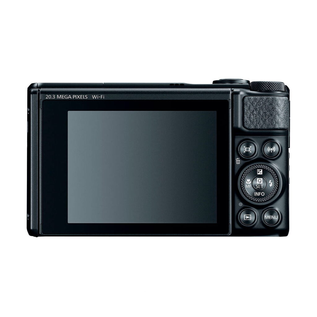 Canon PowerShot SX740 HS -kompaktikamera näkyy takaa, ja siinä on suuri näyttö ja useita ohjauspainikkeita oikealla puolella, kuten suuntauspainike, valikkopainike ja kuvioitu kahva-alue.