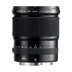 Fujinon_GF_23mm_f_4_R_WR_001 The Fujifilm Fujino GF 23mm f/4 R LM WR lens stands upright against a white background, showing its wide focus ring, aperture markings and metal lens mount.