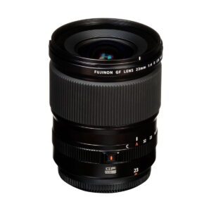 Fujinon_GF_23mm_f_4_R_WR_003 The Fujifilm Fujino GF 23mm f/4 R LM WR lens stands upright on a white background, with its focus and aperture rings clearly marked with stickers and labels.