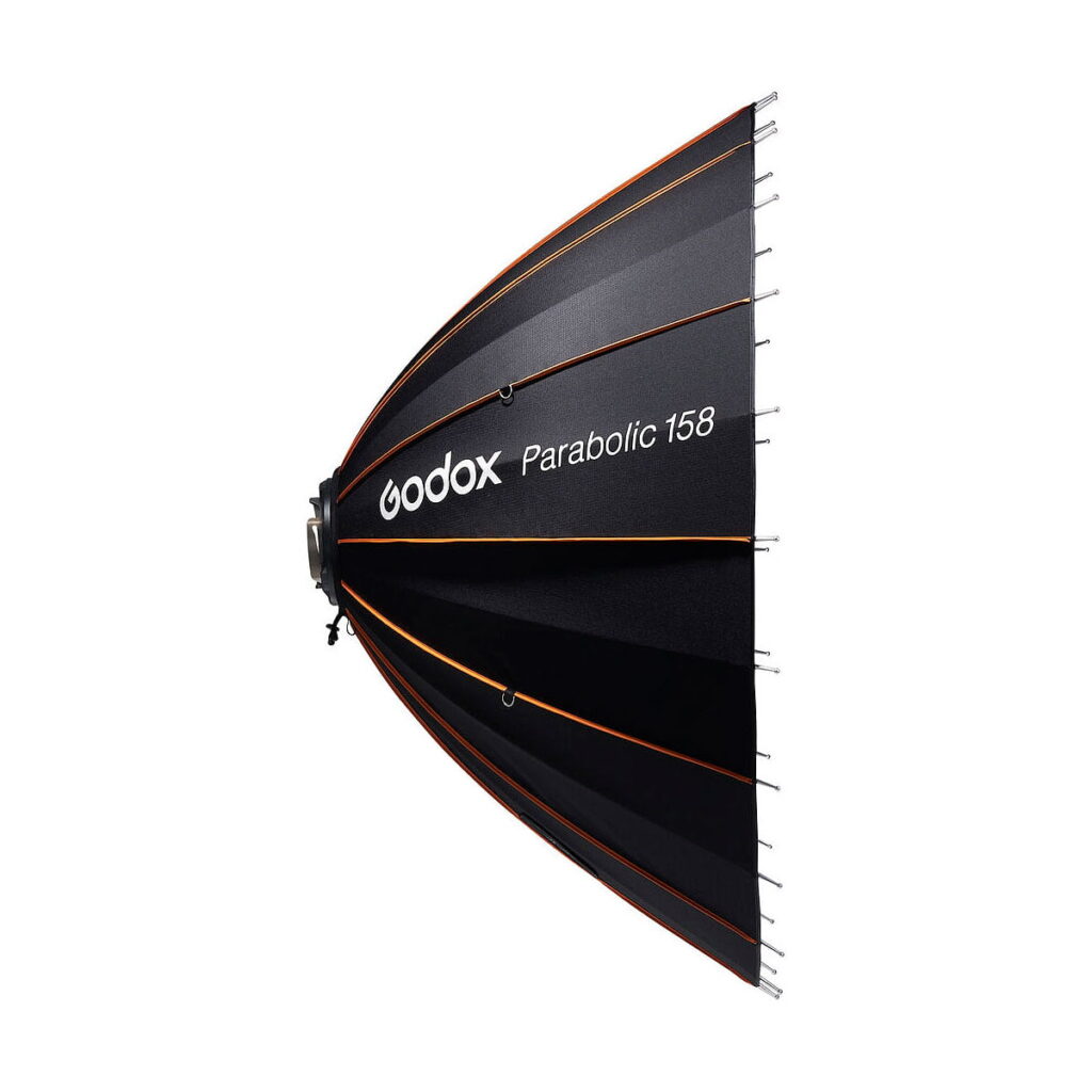Godox_Parabolic_158_Reflector_Kit_004 The Godox Parabolic 158 reflector set, black with orange border, is visible in profile against a white background. The brand and model are shown in white text on the side.