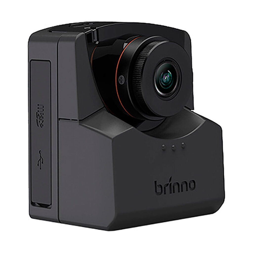 Brinno_TLC_2020_Timelapse_Camera_001 The Brinno TLC2020 Timelapse camera is black, with a wide-angle lens, a USB slot on the side and three front indicator lights on a white background.