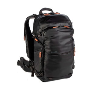 Shimoda Designs Explore v2 25 Starter Kit camera backpack in black with brown zipper pulls, padded shoulder straps and a waistband that shows on a white background.