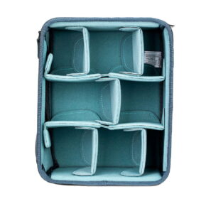The Shimoda Designs Small Core Unit Camera Backpack is a padded camera bag insert with adjustable teal-colored dividers that provide organized, protective compartments for your camera gear inside your bag or backpack.