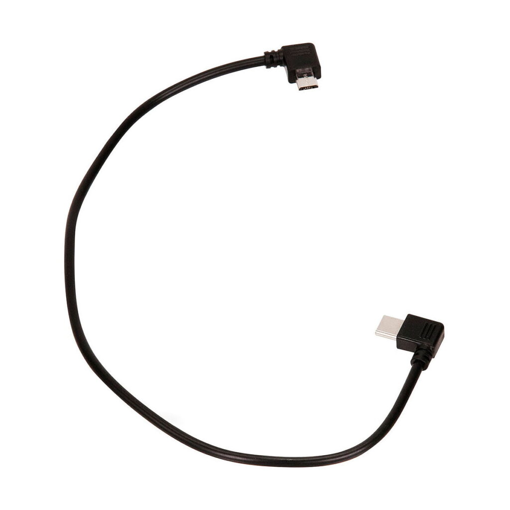 Nucleus-Nano_Micro_USB_to_USB-C_Motor_Power_Cable_002 Tilta Nucleus-Nano Micro USB - USB-C -moottorin virtakaapelissa, joka on kuvassa käärittynä löysään käyrään valkoisella pohjalla, on mustat suorakulmaiset liittimet: yksi Micro USB ja yksi USB-C.