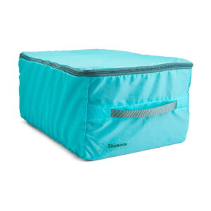 Shimoda_Designs_Extra_Large_DV_Core_Unit_004 Shimoda Designs Extra Large DV Core Unit -kamerareppu on turkoosi suorakulmainen vetoketjullinen säilytyspussi, jossa on sivukahva, Shimoda-brändi edessä ja pehmeä pehmustettu rakenne tavaroiden järjestämiseen tai suojaamiseen.