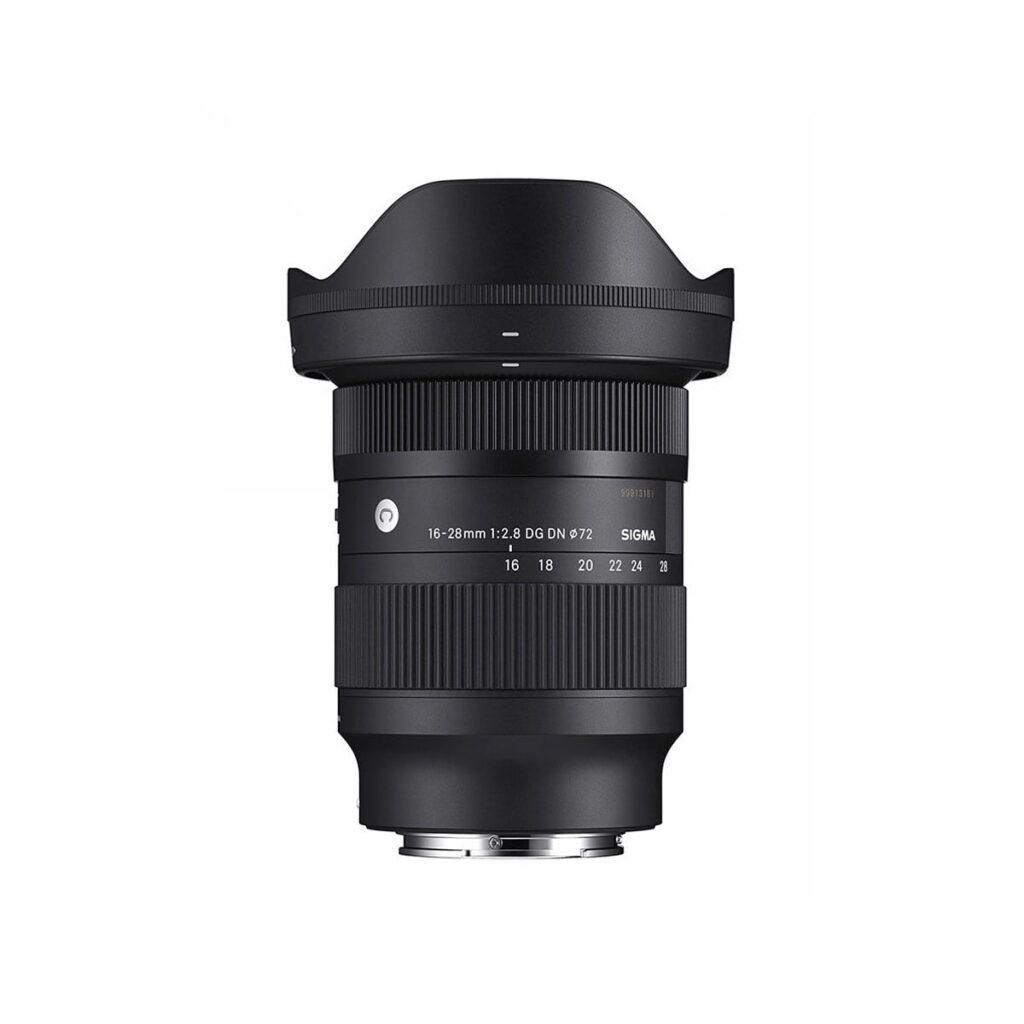 Sigma-16-28mm-f2.8-DG-DN-C-1 The Sigma 16-28mm f/2.8 DG DN Contemporary lens (Sony E), black, stands upright on a white background, with a wide hood and clear focal length and aperture markings on the barrel.