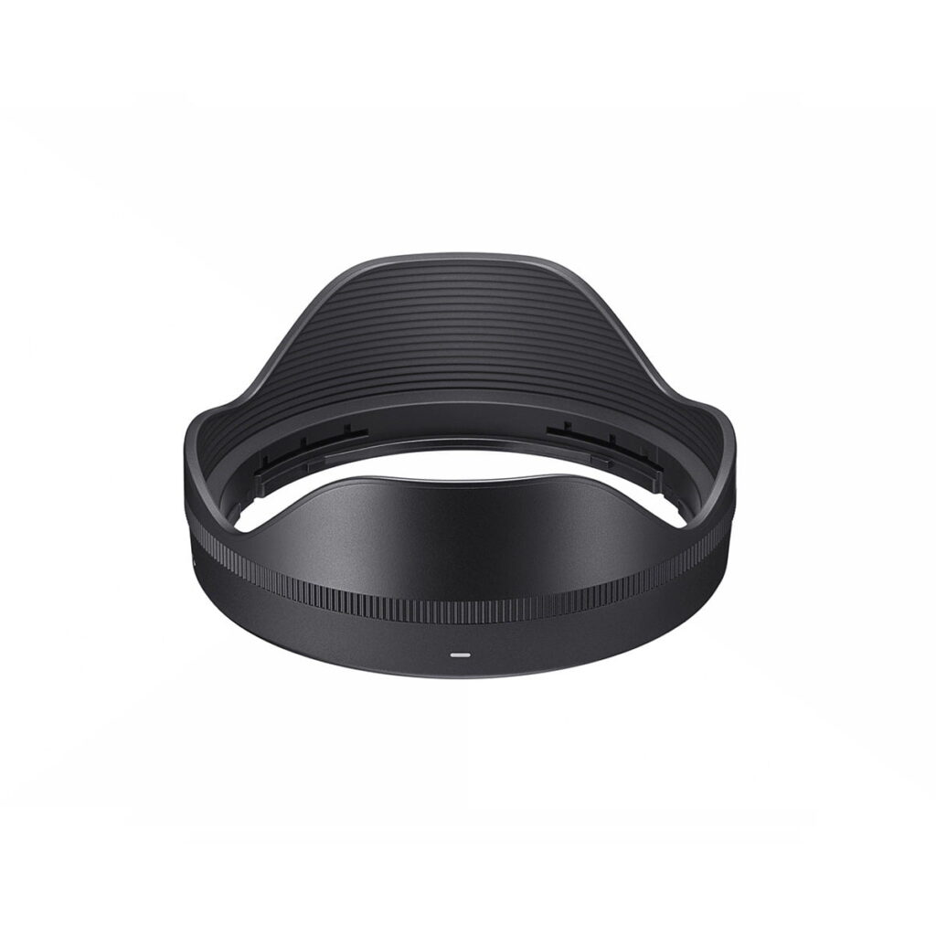 Sigma-16-28mm-f2.8-DG-DN-C-4 Sigma 16-28mm f/2.8 DG DN DN Contemporary has a black petal-shaped hood with grooved interior for the Sony E, seen from the front against a white background.