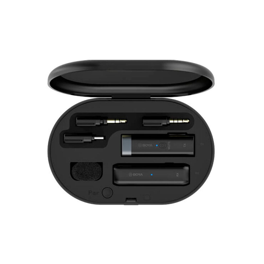 Boya-BY-WM3U-3 The Boya BY-WM3U Wireless USB-C Microphone Kit contains two black wireless microphones, cables and accessories neatly organized in an open oval charging case.