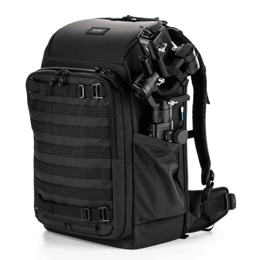 Tenba-Axis-V2-32L-6 The Tenba Axis V2 32L Backpack is a black camera backpack with a side compartment for a mounted gimbal, multiple zippered pockets, adjustable straps and a MOLLE mesh front for accessories.