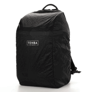 Tenba-Axis-V2-32L-8 The Tenba Axis V2 32L Backpack is a black, weatherproof backpack with a crinkled lid and a white Tenba logo on the front, which appears upright against a white background.