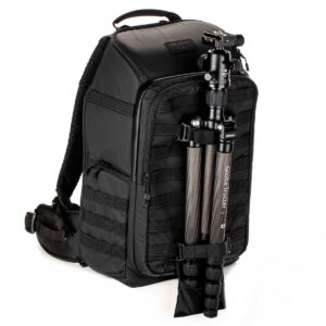 Tenta-axis V2-6 The Tenba Axis V2 24L Backpack is a black camera backpack with multiple compartments and zippers, as well as front straps for tripod attachment.