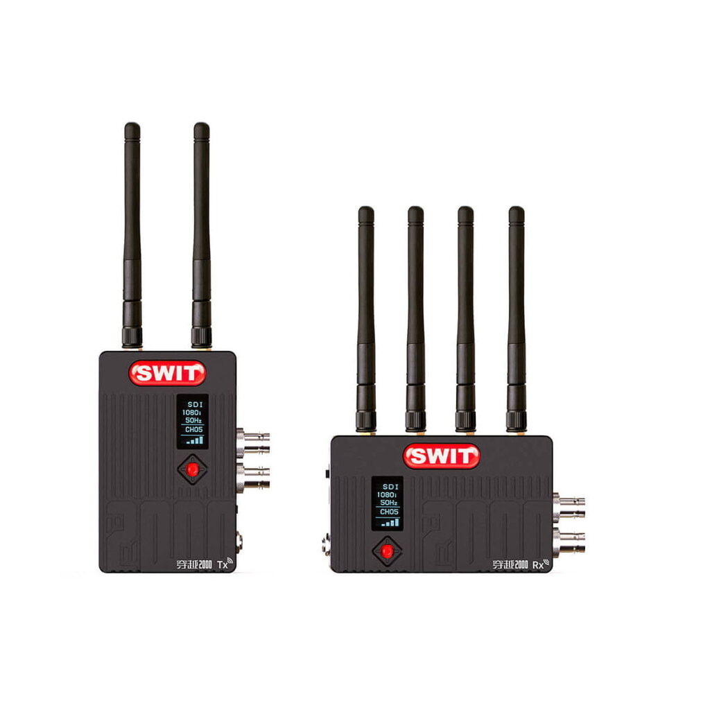 Swit_Flow2000_Tx_Rx_Wireless_SDI_HDMI_Kit_002 Two black Swit Flow2000 Tx+Rx Wireless SDI/HDMI units: the transmitter on the left has two antennas and a small display; the receiver on the right has four antennas and extra connection ports.