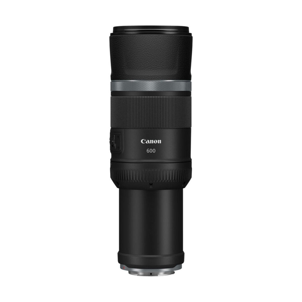 canon_rf_600mm_is_stm_01 The Canon RF 600mm f/11 IS STM lens is upright on a white background, with a black body, textured grip and visible control dials.