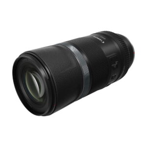 canon_rf_600mm_is_stm_02 A Canon RF 600mm f/11 IS STM lens, black construction, against a white background. The lens has a milled grip, focus adjustment ring, detailed markings and a switch on the side.