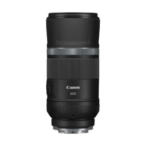 canon_rf_600mm_is_stm_03 The Canon RF 600mm f/11 IS STM lens is shown upright against a white background. The black lens has both textured and smooth parts, and the control switches are visible on the side.
