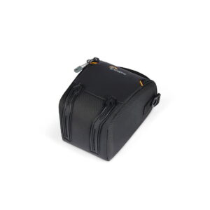 lowepro_tlz_30_iii_01 The Lowepro Adventura TLZ 30 III is a black, compact camera bag with a zippered top, two raised front handles and a small side flap, shown in white.