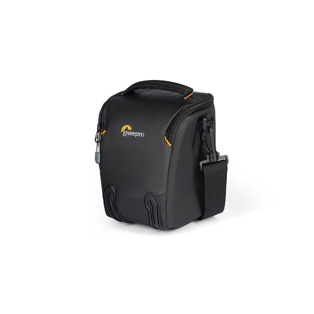 lowepro_tlz_30_iii_04 The Lowepro Adventura TLZ 30 III is a compact black camera bag with a zipped design, top handle, shoulder strap and yellow accents on a white background. It is designed to carry and protect your cameras safely.