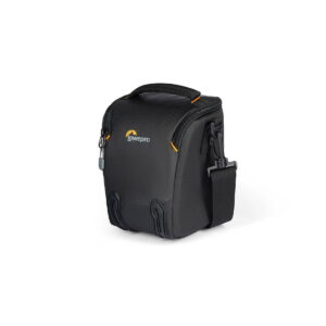lowepro_tlz_30_iii_04 The Lowepro Adventura TLZ 30 III is a compact black camera bag with a zipped design, top handle, shoulder strap and yellow accents on a white background. It is designed to carry and protect your cameras safely.