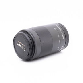 Canon 55-200mm-1 Sigma DC 17-50mm f/2.8 EX HSM OS Canon EF-S lens (used) lying on its side against a white background, lens cap attached and focal length markings visible on the barrel.