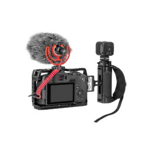 SmallRig_Mini_Side_Handle_1_4-20_Screws_2916_003 The digital camera in a protective cage features a fuzzy microphone, wrist strap, top-mounted light and SmallRig 2916 Mini Side Handle (1/4"-20 Screws), all against a white background.