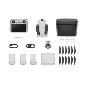 DJi_Mini_3_RC_Fly_MoreCombo_001 The DJI Mini 3 + Smart Controller + Fly More Combo top-down, with the drone (folded), smart controller, carrying case, screwdriver, cables, charging hub, spare propellers, batteries and screws neatly arranged on a white background.