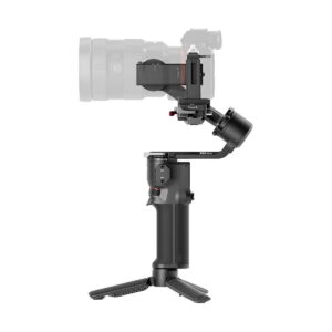 DJi_RS_3_Mini_005 The DJI RS 3 Mini gimbal, a black handheld camera gimbal stabilizer with stand, is shown holding a semi-transparent camera against a white background.