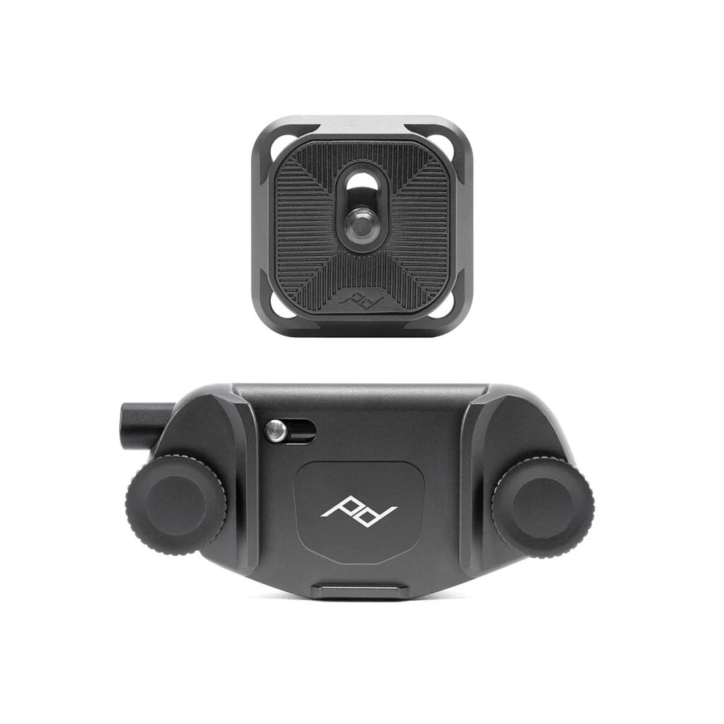 Peak_Design_Capture Peak Design Capture - Black is a black camera mount with a quick-release base plate, both with a modern, minimalist design and the Peak Design logo.
