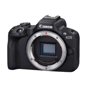 canon_r50_runko_04 The black Canon EOS R50 system camera body is shown without the lens, revealing its exposed image sensor and camera mount. The Canon logo appears above the sensor.