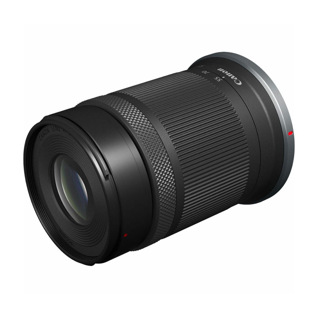 canon_rf-s_55-210mm_01 The Canon RF-S 55-210mm F5-7.1 IS STM lens features a textured grip, focus ring and glass front element, shown in black against a white background.