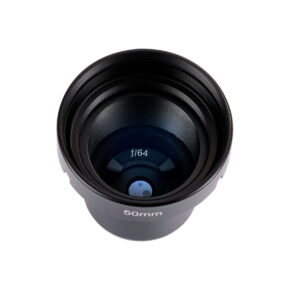 lensbaby_obscura_50_optic The Lensbaby Obscura 50 Optic is a black 50mm camera lens, shot from above, showing its internal glass elements and the f/64 marking in the centre against a white background.