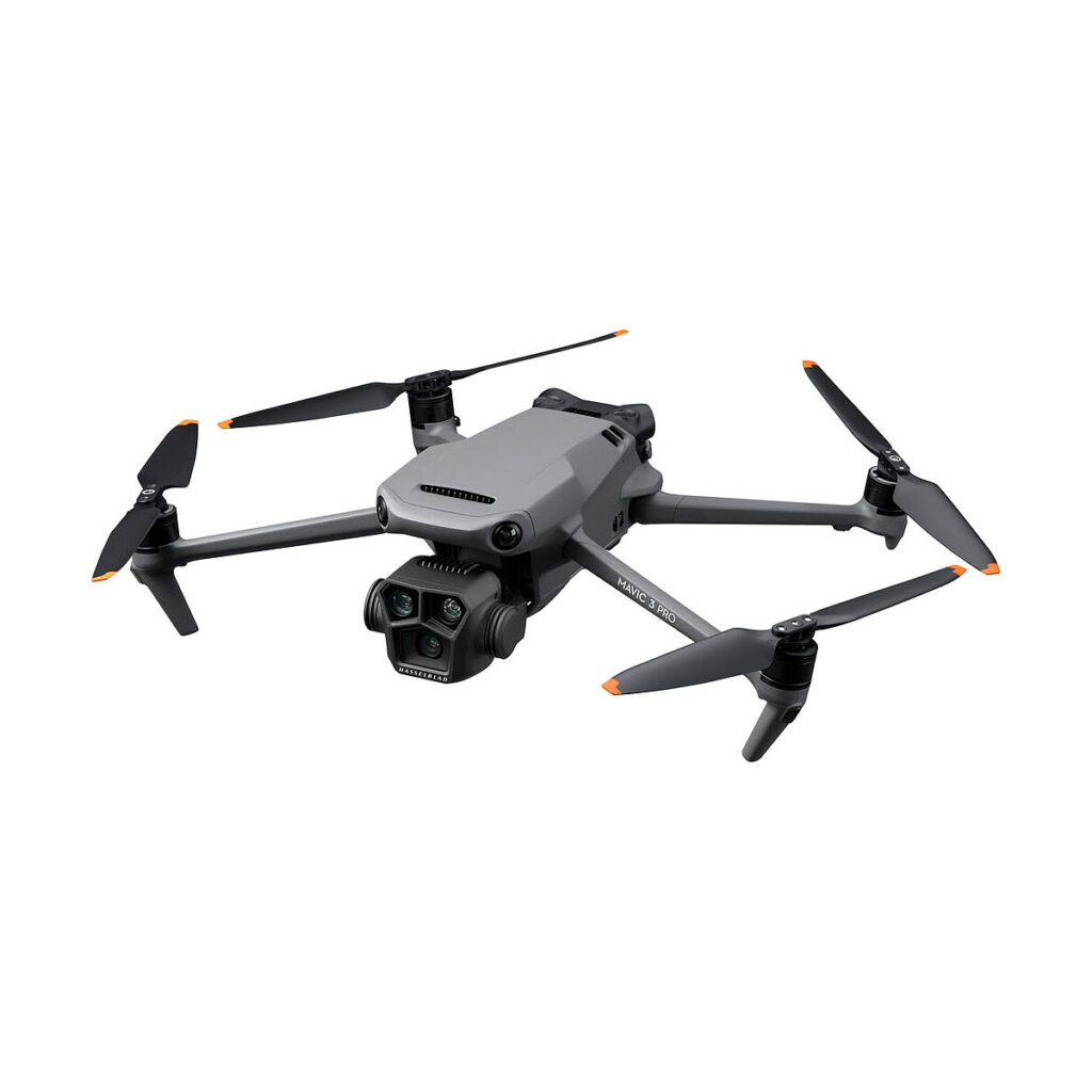 DJI_Mavic_3_Pro_001 The DJI Mavic 3 Pro + DJI RC Controller is a grey quadcopter with four orange-tipped propellers and a gimbaled camera.