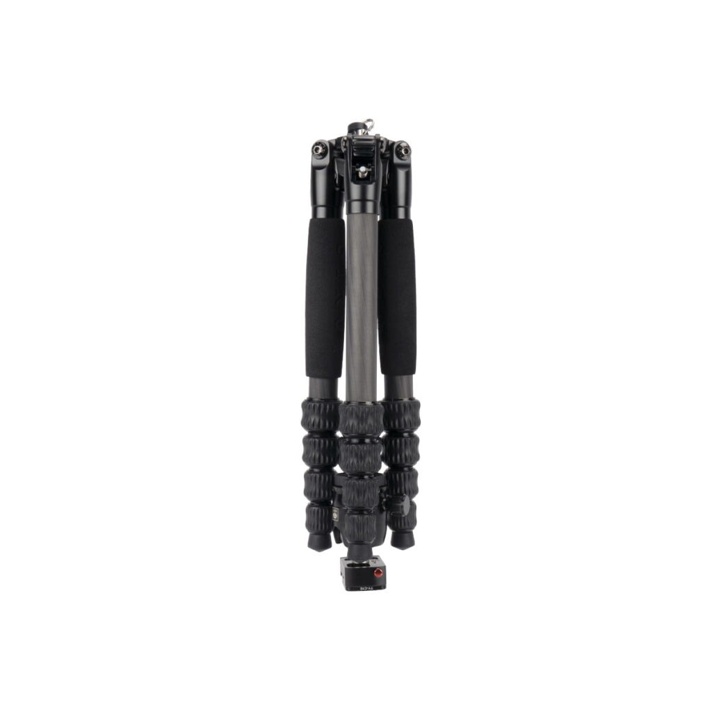 traveler_5cx_01 The Sirui Traveler 5CX is a compact black tripod with foam handles and twist-lock legs. It is shown folded and upright against a white background.