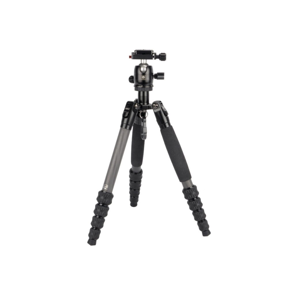 traveler_5cx_02 The Sirui Traveler 5CX is a black and grey camera tripod with foam handles on two legs, adjustable footrests and a ball head mount, shown in white.